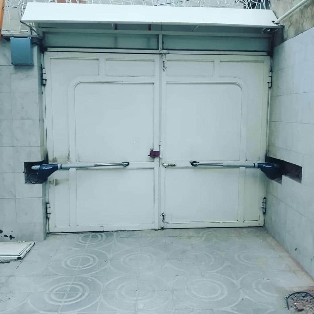 نصب جک درب پارکینگ برقی درب لولایی در فیروزکوه