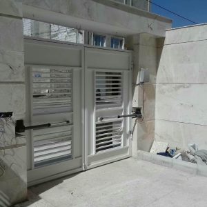 جک درب پارکینگ با موتور بازویی نصب شده روی درب لولایی خرید جک درب پارکینگ با قیمت مناسب